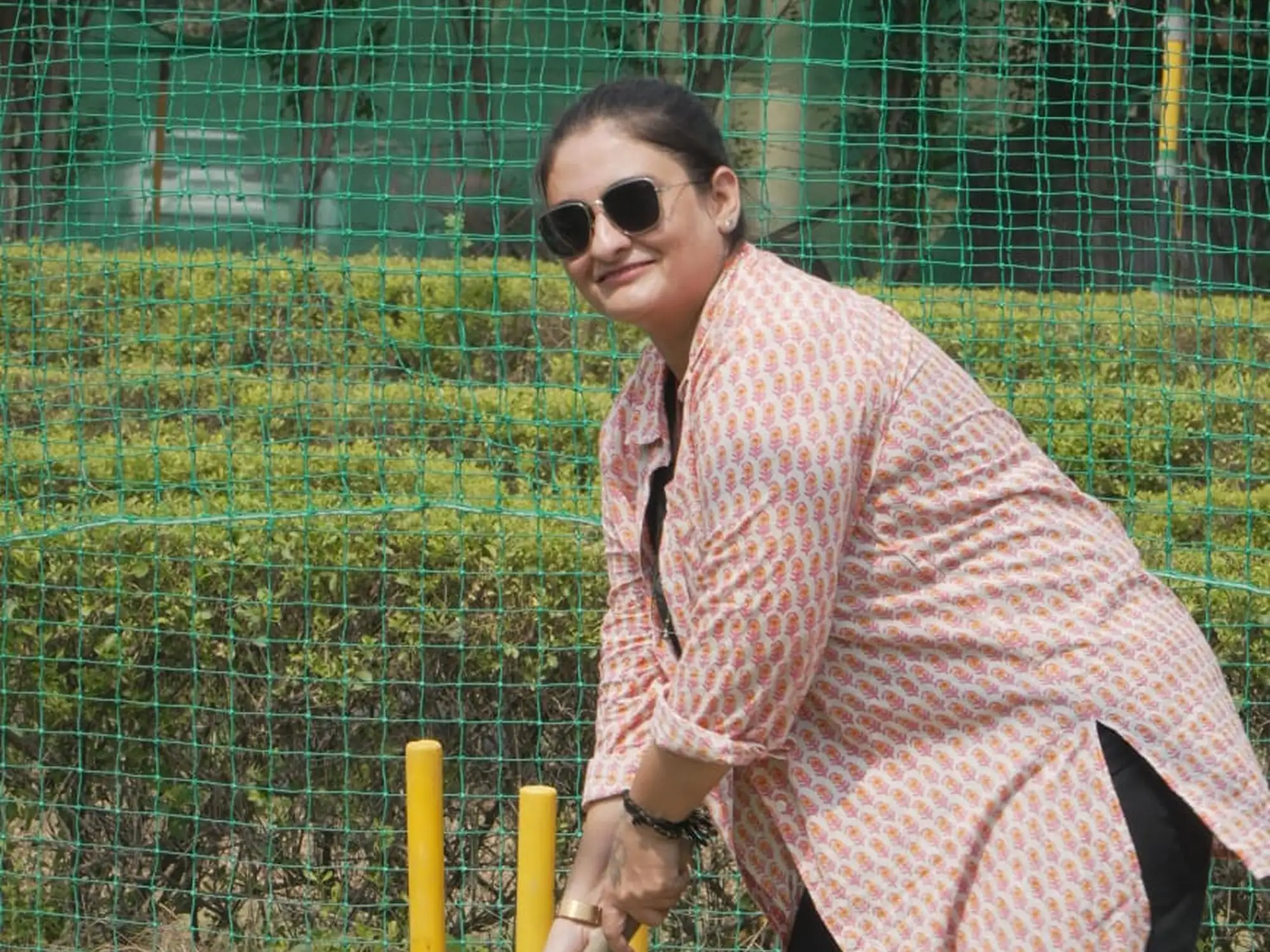 Woman enjoying a cricket activity at Veda Adventures