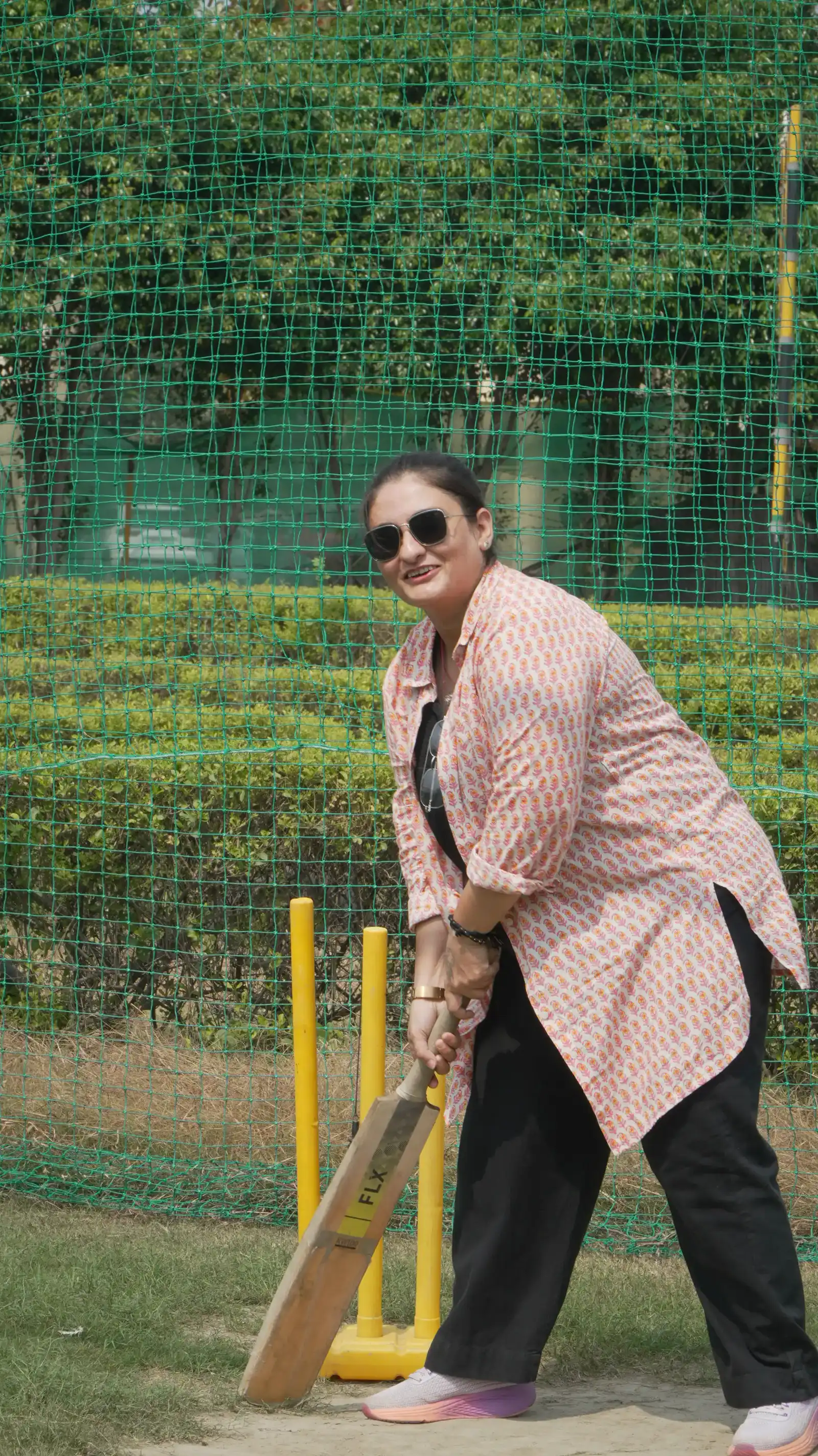 Batting in the box cricket net at Veda Adventures Park