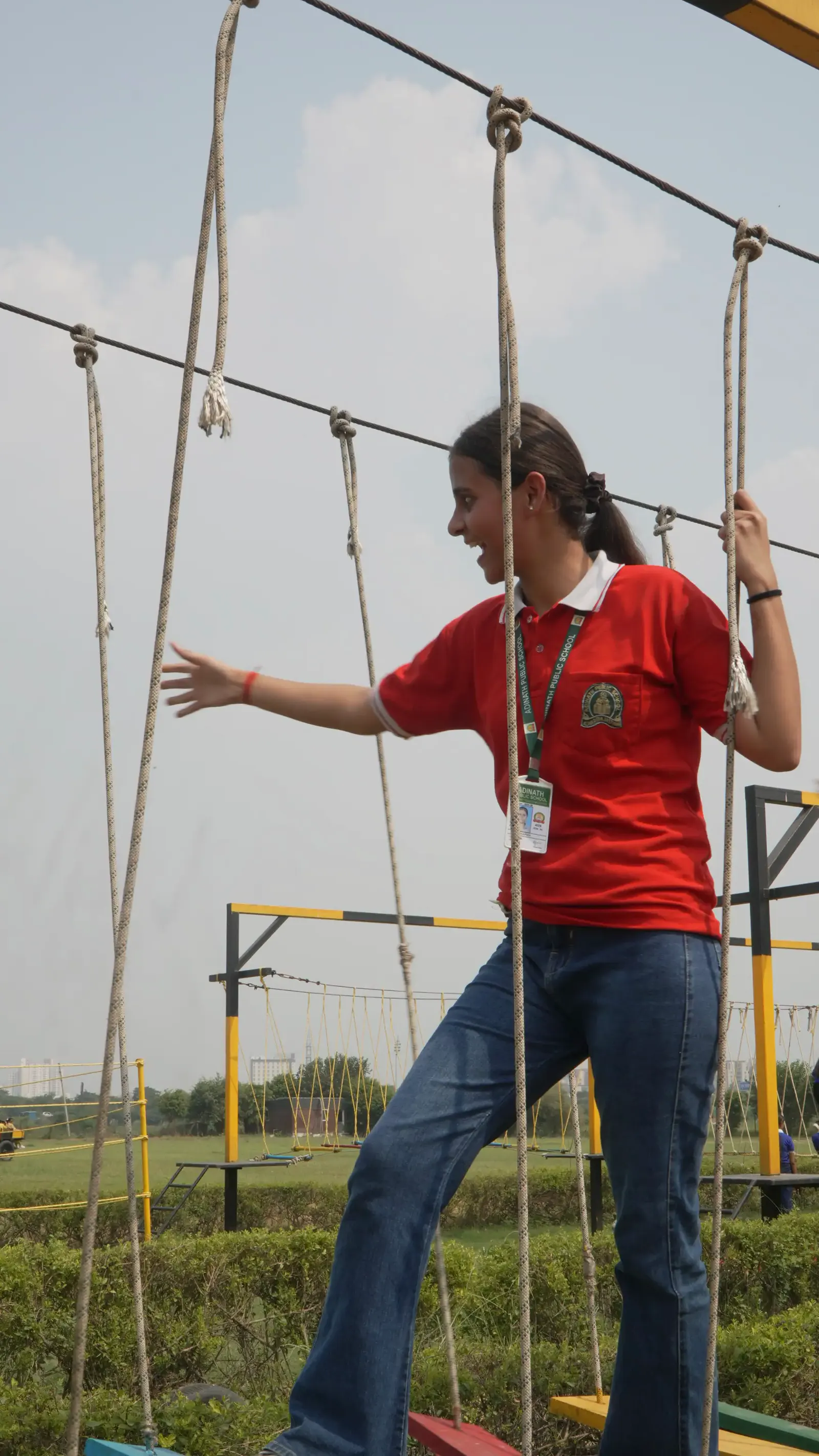 Team member crossing the high rope walk during a corporate outing