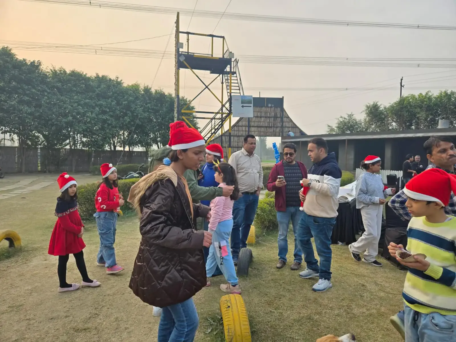 Indian adults and children celebrating together at Veda Adventures Park