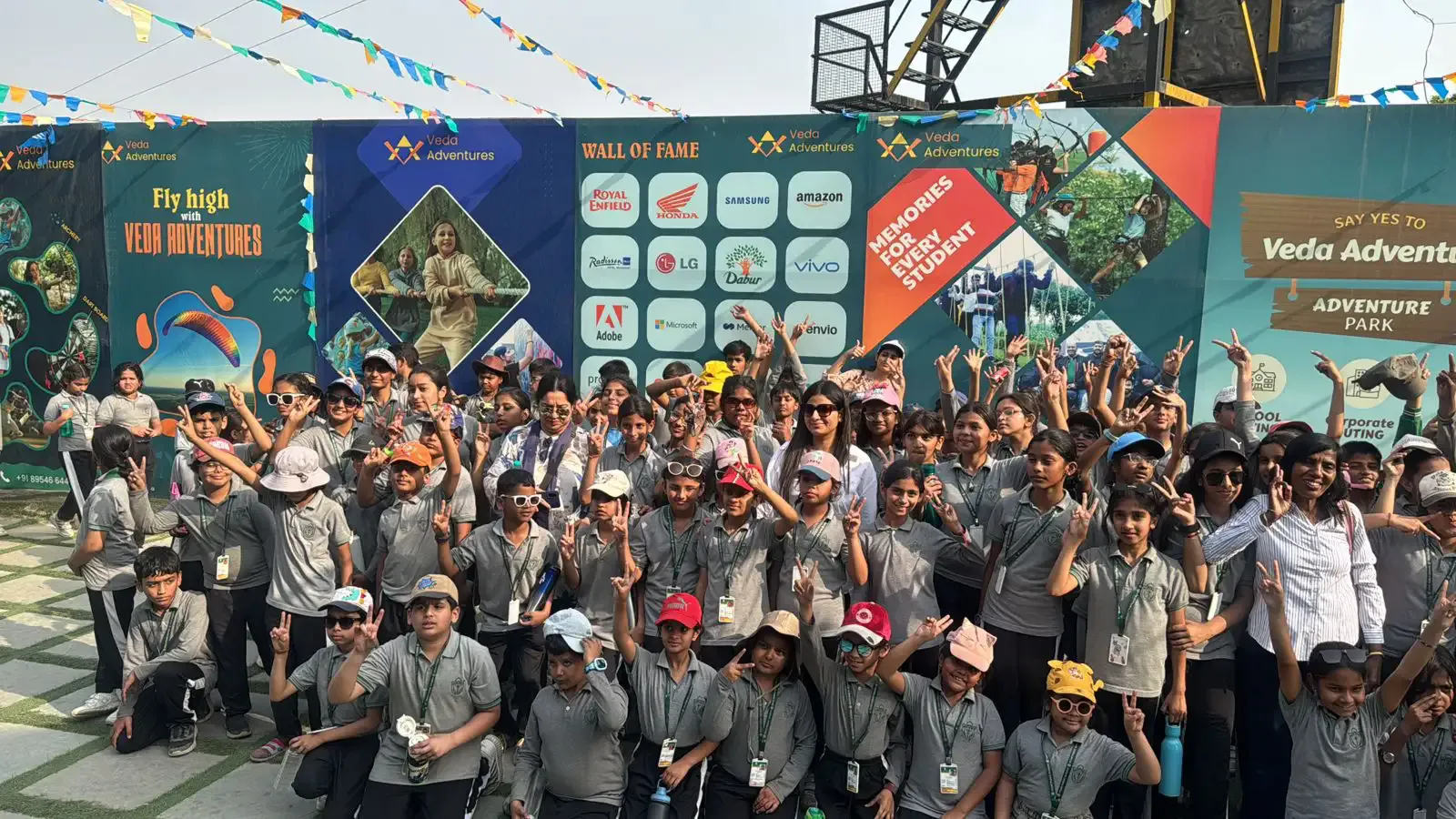 School group photographed at the Veda Adventures Park backdrop in Noida